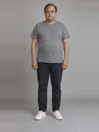 Abhijit, an Aaina AI studio model: Man, 48 · South Asian · Average