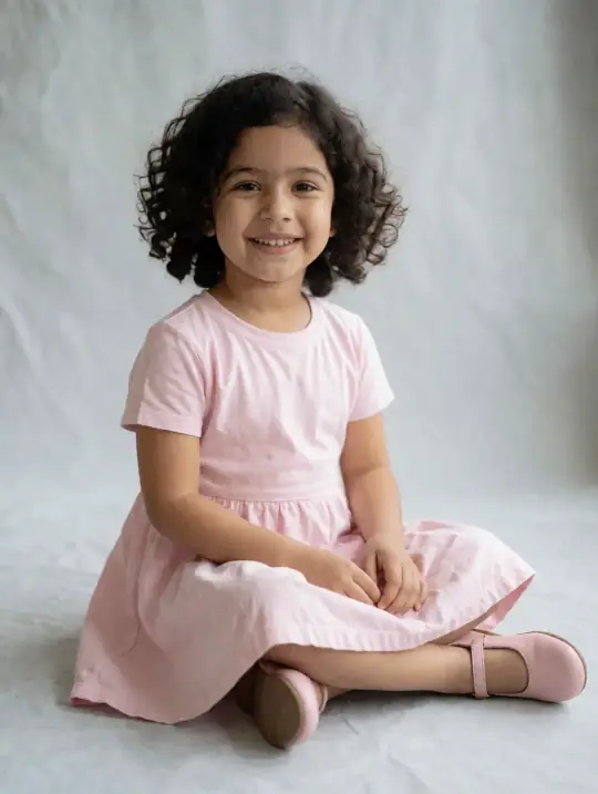 Pari, an Aaina model, in the pose Frock spread on the floor