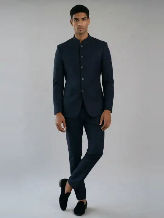 Rehan, an Aaina model, in the pose Bandhgala, cross-leg stance, navy
