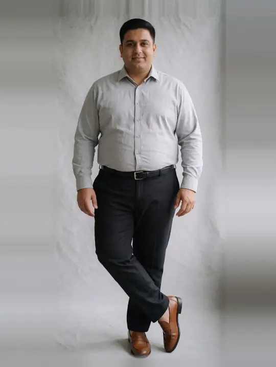 Rohit, an Aaina model, in the pose Cross-leg stance, grey formal shirt