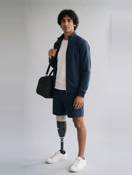 Dev, an Aaina AI model: South Asian heritage, early 30s, prosthetic leg