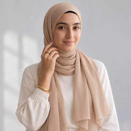 Layla, an Aaina model, wearing or holding the modest outfit in the White Studio scene