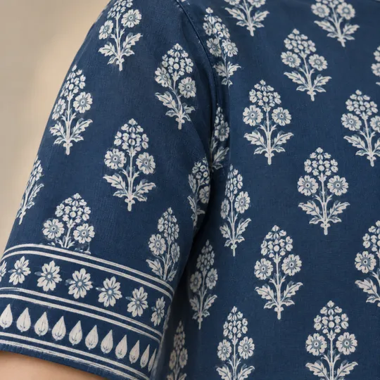 Detail view made in Aaina: a sleeve close-up of an indigo block-print kurti and its border