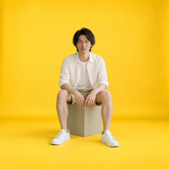 Kenji, an Aaina model, wearing or holding the sneakers in the Mustard Studio scene